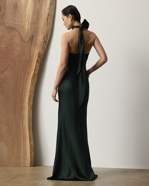 Originating in Spring 2023, the Chilton showcases Mr Lauren's ability to transform timeless silhouettes into modern designs. Crafted in Italy with stretch-infused satin, which is coveted for its beautiful sheen and fluid drape, this evening gown is distinguished by a halter silhouette with self-ties, which cascade beautifully down its dramatic open back.