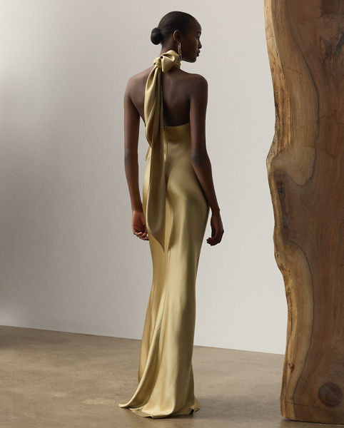 Originating in Spring 2023, the Chilton showcases Mr Lauren's ability to transform timeless silhouettes into modern designs. Crafted in Italy with stretch-infused satin, which is coveted for its beautiful sheen and fluid drape, this evening gown is distinguished by a halter silhouette with self-ties, which cascade beautifully down its dramatic open back.