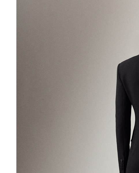 The double-breasted jacket, one of  Ralph Lauren Lauren's most enduring silhouettes, is re-imagined this season as a chic, thigh-grazing cocktail dress. Italian-made with double-faced wool and lined with our signature jacquard fabric, the Cottrell’s mini silhouette is tailored with traditional suiting elements, including silk faille peak lapels, flapped pockets and a welt pocket on the chest. Cut for a wider shoulder and fitted at the waist and skirt, this dress is finished with silk faille-covered buttons on the placket and the sleeves.