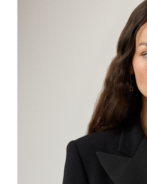 The double-breasted jacket, one of  Ralph Lauren Lauren's most enduring silhouettes, is re-imagined this season as a chic, thigh-grazing cocktail dress. Italian-made with double-faced wool and lined with our signature jacquard fabric, the Cottrell’s mini silhouette is tailored with traditional suiting elements, including silk faille peak lapels, flapped pockets and a welt pocket on the chest. Cut for a wider shoulder and fitted at the waist and skirt, this dress is finished with silk faille-covered buttons on the placket and the sleeves.