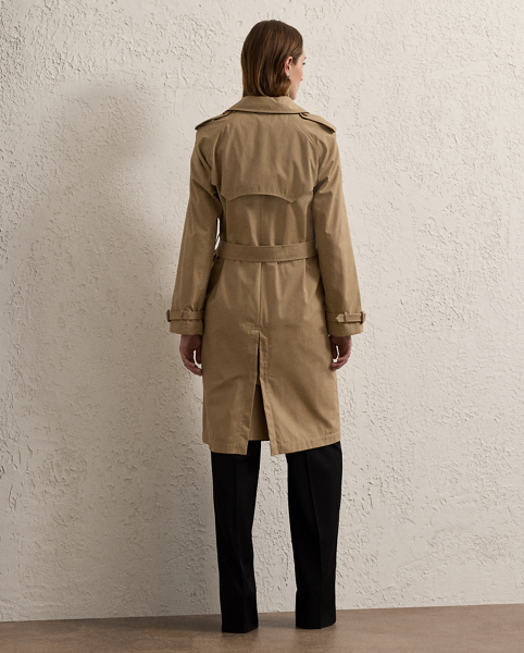The Italian-made Niles is designed with traditional trench coat details, including buttoned shoulder epaulettes, storm flaps, a belted collar and waist and a double-breasted silhouette, and is made from water-resistant cotton twill fabric for a soft, dry hand feel. Imitation horn buttons, lamb suede-covered buckles and a debossed logo on the undercollar add refinement to its timeless design.