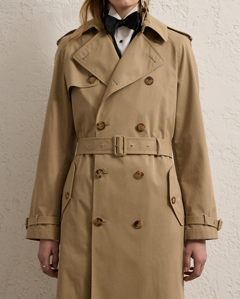 The Italian-made Niles is designed with traditional trench coat details, including buttoned shoulder epaulettes, storm flaps, a belted collar and waist and a double-breasted silhouette, and is made from water-resistant cotton twill fabric for a soft, dry hand feel. Imitation horn buttons, lamb suede-covered buckles and a debossed logo on the undercollar add refinement to its timeless design.