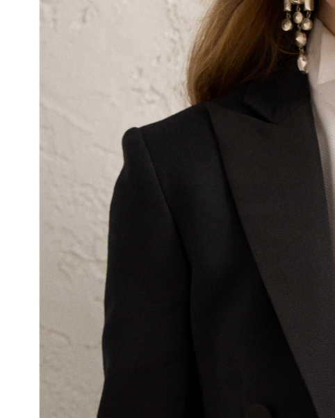 Inspired by one of Ricky Lauren’s personal tuxedo jackets, the Spencer is designed with a sleek cropped fit, a double-breasted silhouette and silk faille peak lapels. Italian-made, this style is woven with highly twisted crepe yarns for a modern drape and lightweight feel.