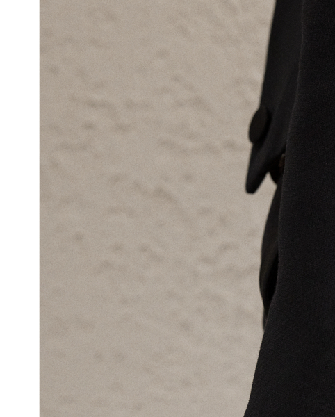 Inspired by one of Ricky Lauren’s personal tuxedo jackets, the Spencer is designed with a sleek cropped fit, a double-breasted silhouette and silk faille peak lapels. Italian-made, this style is woven with highly twisted crepe yarns for a modern drape and lightweight feel.