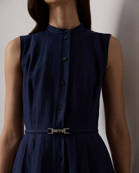 Inspired by our Freida dress, the Kennedi's studied design unites four linen panels, which have undergone a heat-press fabric manipulation technique to create a stunning pleated effect on the skirt. Crafted from rustic-yet-chic Italian linen in a classic construction for season-spanning wear, this day dress is cinched at the waist with a self-belt centred by a signature " Ralph Lauren Lauren"-engraved plaque buckle.