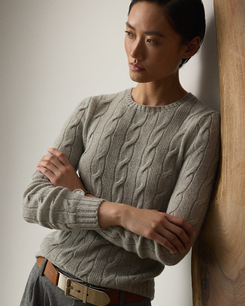 A timeless icon designed to stand the test of time, our Cradle to Cradle Certified (C2C Certified) Gold Cable-Knit Crewneck Jumper is knit with fine cashmere fibres sourced in Italy, dyed in rich hues and features a re-imagined cotton signature label. C2C certification is the global standard for products that are safe and circular. Ralph Lauren Lauren partnered with an independent assessment body to ensure that every component of this jumper meets the C2C Certified Product Standards set by the Cradle to Cradle Products Innovation Institute (C2CPII).