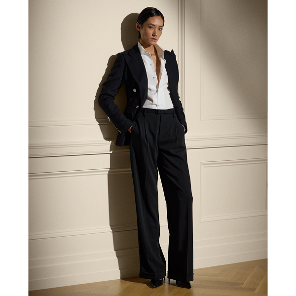 A wider-leg version of our iconic Stamford trouser, the Acklie defines Ralph Lauren Lauren's signature menswear-inspired trousers for women, as it's designed with front pleats and crisp leg creases. Its wool gabardine fabric, woven in a revered Italian mill, produces its soft hand and nice drape. A self-belt elevated by a petite square-shaped buckle creates definition at the waist, while a high-rise fit evokes a strong feminine aesthetic.