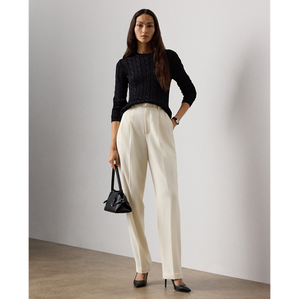 A wider-leg version of our iconic Stamford trouser, the Acklie, which is designed with front pleats and crisp leg creases, is a classic example of Ralph Lauren Lauren's signature menswear-inspired trousers for women. Its wool gabardine fabric, woven in a revered Italian mill, produces its soft hand and attractive drape. A self-belt elevated by a petite square-shaped buckle creates definition at the waist, while a high-rise fit evokes a strong feminine aesthetic.