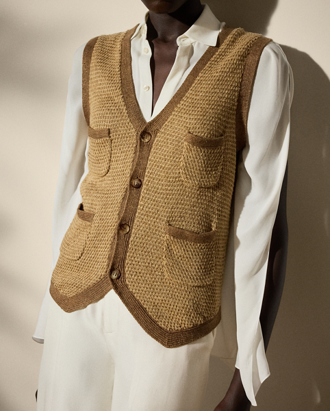 Crafted in Italy, this figure-skimming style updates the traditional waistcoat with genuine horn buttons, patch pockets and a rustic linen-and-silk construction, which is knitted at the front in a birdseye jacquard configuration to recreate a classic tweed visual.