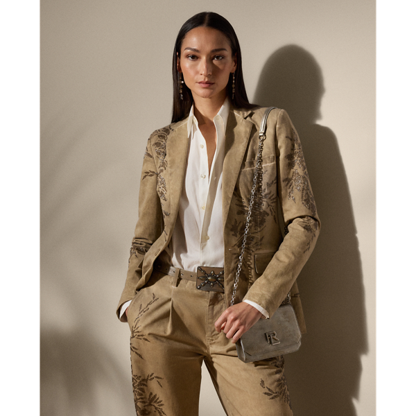 Equestrian-style hacking pockets and genuine mother-of-pearl buttons adorn this season’s iteration of the Parker jacket, which is crafted from 100% Italian cotton twill woven with a left hand and specially washed with cold pigment for added softness and a timeworn look. Using a special dyeing process to achieve irregular colouring, this jacket is embroidered by four technicians with a traditional Aari technique, carefully placing each bead and metallic thread to recreate a floral motif that follows this style’s dyed effect.