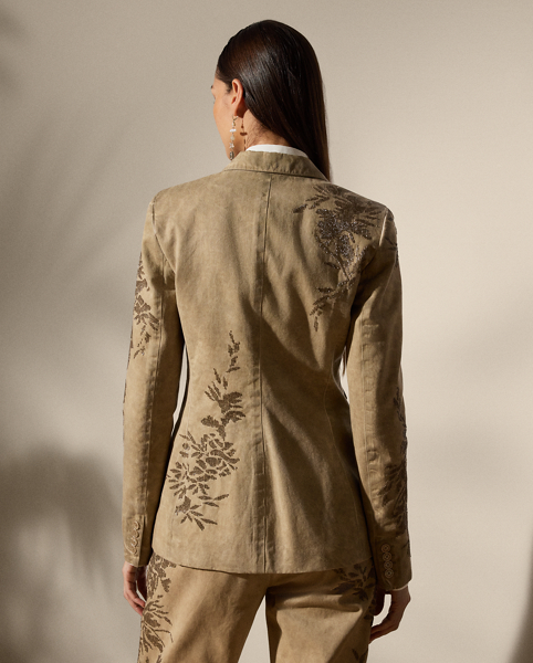 Equestrian-style hacking pockets and genuine mother-of-pearl buttons adorn this season’s iteration of the Parker jacket, which is crafted from 100% Italian cotton twill woven with a left hand and specially washed with cold pigment for added softness and a timeworn look. Using a special dyeing process to achieve irregular colouring, this jacket is embroidered by four technicians with a traditional Aari technique, carefully placing each bead and metallic thread to recreate a floral motif that follows this style’s dyed effect.