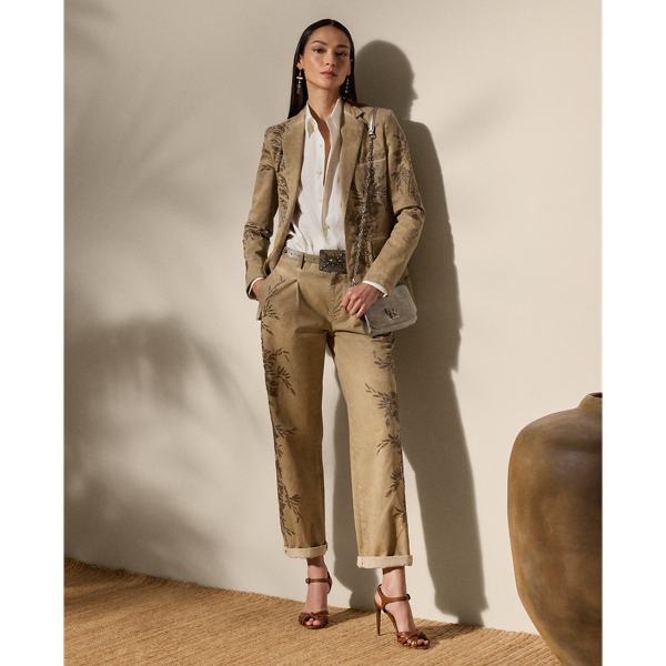 A timeless wardrobe staple, the Fallon modernises the essential chino trouser with a relaxed fit, welt pockets and a flattering mid-rise. Crafted from 100% Italian cotton twill, which is woven with a left hand and specially washed with cold pigment for added softness and a timeworn appearance, this version undergoes a unique artisanal process to achieve its final look. Using a special dyeing method to create irregular colouring, this pair is embroidered by four technicians with a traditional Aari technique, carefully placing each bead and metallic thread to recreate a floral motif that follows this style's dyed effect.