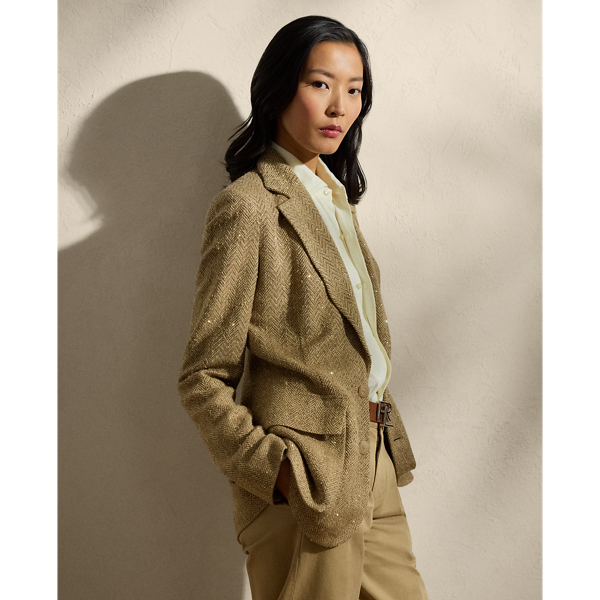 Designed with genuine horn buttons and tonal herringbone tweed – a fabric made from a luxurious blend of silk, tussah silk and linen for a soft hand feel – this jacket draws inspiration from one of Mr Lauren’s own blazers. Featuring patch pockets and a buttoned throat latch on the collar, this version of our Preston is detailed with 53,280 hot-fixed crystals which are carefully applied by a team of five highly trained technicians to follow the jacket’s herringbone motif.