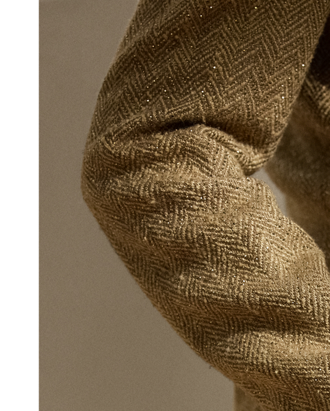 Designed with genuine horn buttons and tonal herringbone tweed – a fabric made from a luxurious blend of silk, tussah silk and linen for a soft hand feel – this jacket draws inspiration from one of Mr Lauren’s own blazers. Featuring patch pockets and a buttoned throat latch on the collar, this version of our Preston is detailed with 53,280 hot-fixed crystals which are carefully applied by a team of five highly trained technicians to follow the jacket’s herringbone motif.