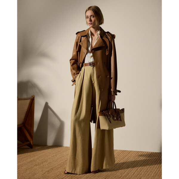 The Italian-made Niles is designed with traditional trench coat details, including buttoned shoulder epaulettes, storm flaps, a belted collar and waist and a double-breasted silhouette, and is made from supple nappa lambskin for a luxurious look. Imitation horn buttons, lambskin-covered buckles and a debossed logo on the undercollar add refinement to its timeless design.