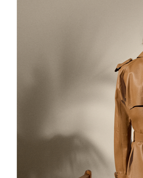 The Italian-made Niles is designed with traditional trench coat details, including buttoned shoulder epaulettes, storm flaps, a belted collar and waist and a double-breasted silhouette, and is made from supple nappa lambskin for a luxurious look. Imitation horn buttons, lambskin-covered buckles and a debossed logo on the undercollar add refinement to its timeless design.
