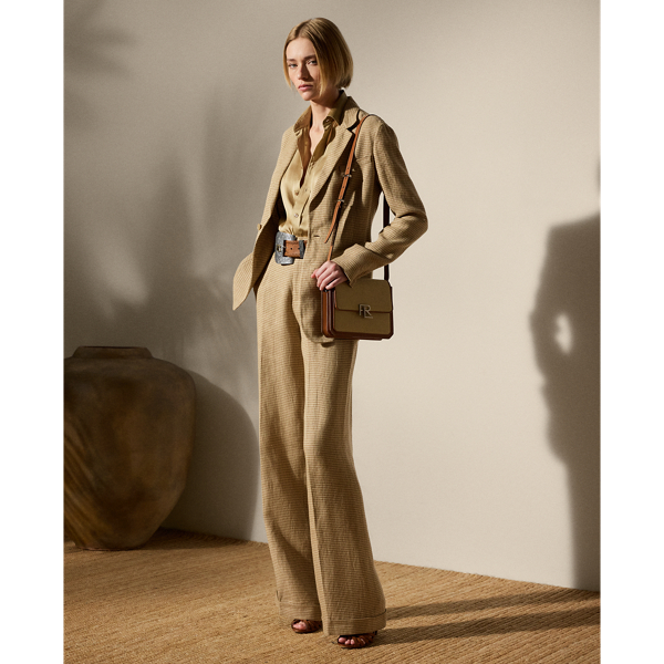 A wider-leg version of our iconic Stamford trouser, the Acklie is designed with front pleats and crisp leg creases. Made in Portugal, this season's iteration is crafted from linen tweed in a timeless houndstooth weave. A self-belt elevated by a petite square-shaped buckle creates definition on the waist, while a high-rise fit evokes a strong aesthetic.
