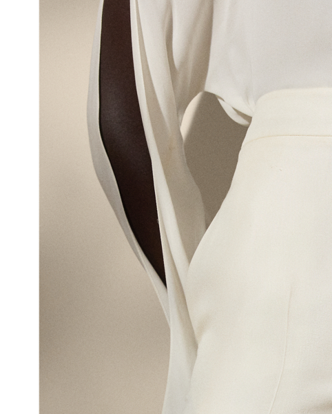 Traditionally tailored with leg creases and waist darts, the Dean trouser is fitted through the waist and hip with a slightly wider leg. This version is crafted from silk shantung – a fabrication woven with ultra-fine slub yarn – to create a rustic look and a soft hand.
