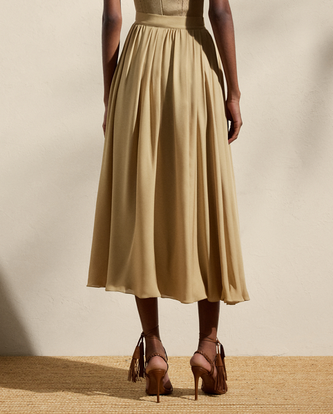 Crafted from our Italian double silk georgette, which is valued for its soft, delicate drape, the Kynlee skirt enhances the traditional A-line silhouette with asymmetrical pleats for sweeping movement and added dimension.