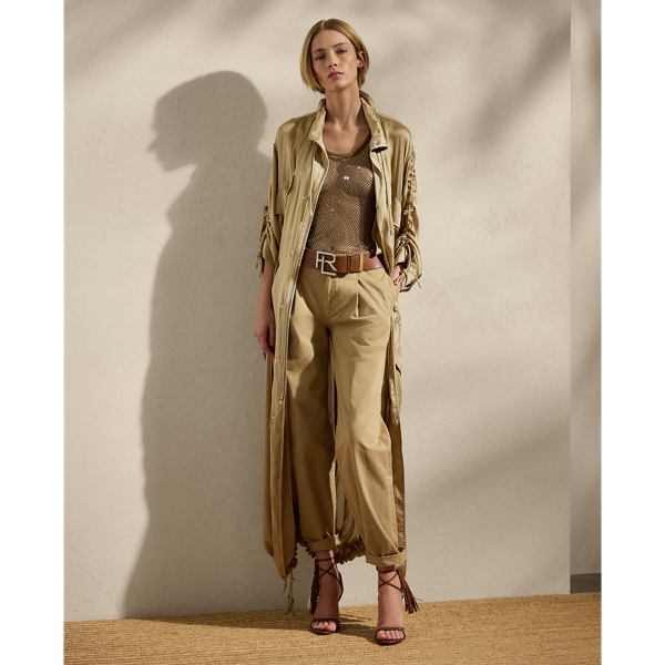 Crafted with ultrafine, semi-sheer silk charmeuse, which is beautifully finished for a fluid drape, the Amberly is designed with an array of parachute-style details, including multiple drawcords throughout, signature hardware and a funnelneck. Intended to hit above the ankle, this long coat is cut for a slightly oversize, relaxed fit.