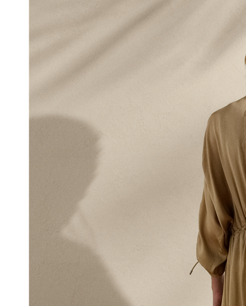 Crafted with ultrafine, semi-sheer silk charmeuse, which is beautifully finished for a fluid drape, the Amberly is designed with an array of parachute-style details, including multiple drawcords throughout, signature hardware and a funnelneck. Intended to hit above the ankle, this long coat is cut for a slightly oversize, relaxed fit.