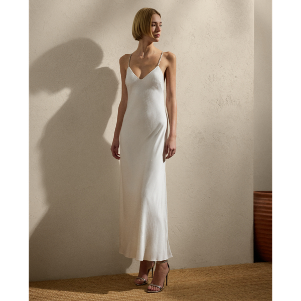 Showcasing Mr Lauren's commitment to fine Italian crafting, a team of six specialised technicians embellished the Shanna dress with 43,200 hot-fixed crystals for a shimmering effect. Featuring crystal-embellished chain straps and French darts for an added touch of glamour, this cocktail dress is crafted with crepe-back satin, which is woven with highly twisted yarns to create a luxurious drape.