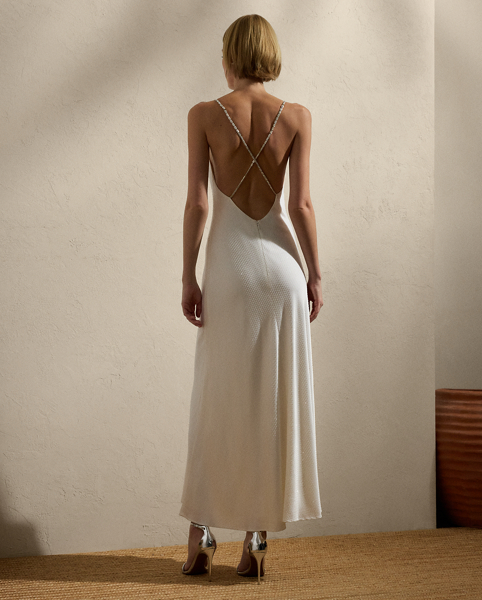 Showcasing Mr Lauren's commitment to fine Italian crafting, a team of six specialised technicians embellished the Shanna dress with 43,200 hot-fixed crystals for a shimmering effect. Featuring crystal-embellished chain straps and French darts for an added touch of glamour, this cocktail dress is crafted with crepe-back satin, which is woven with highly twisted yarns to create a luxurious drape.