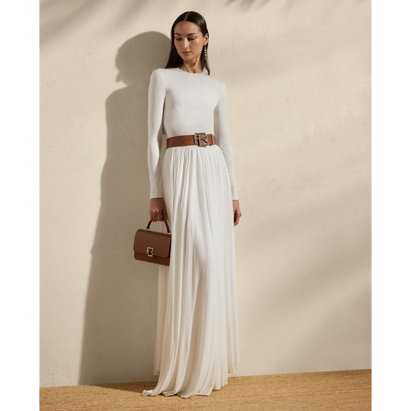 Beautifully understated, this sweeping day dress is crafted with crepe jersey for a flattering fit and a lightweight feel. Its body-skimming bodice is cinched at the waist with a belt, while delicate shirring at the waist and skirt affords effortless elegance.