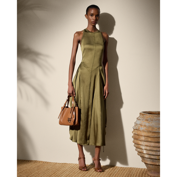 The Sienna day dress is designed with an array of considered details, including a halter neckline, a racerback, rounded skirt panels and triple-needle topstitching. Cut for a calf-grazing length, this A-line style features adjustable drawcords at the side seams for a ruched appearance. This style is crafted with lustrous, washed satin charmeuse for a remarkable drape and soft hand feel.