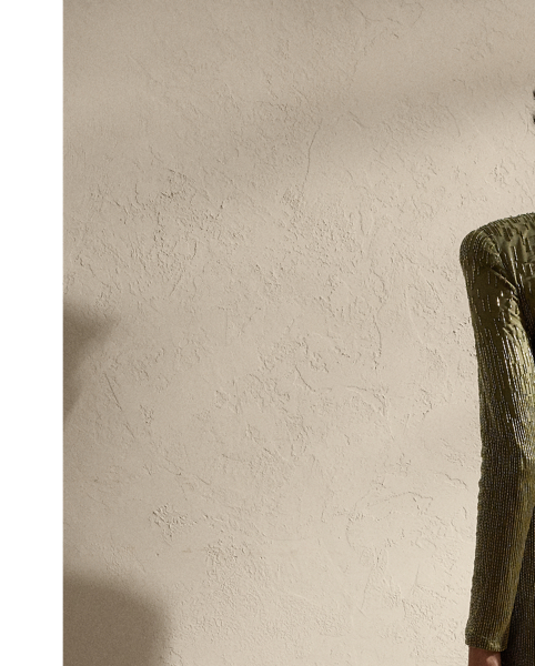 Showcasing Mr Lauren's commitment to fine craftsmanship, the Stacy's body-skimming column silhouette is meticulously hand-embroidered by a team of seven master artisans. Using a traditional Aari technique, glass bugle beads in two distinctive shades are positioned sporadically across the bodice and down the skirt, creating a linear dégradé effect. This romantic evening style features a dramatic plunging neckline framed by delicate ruching.