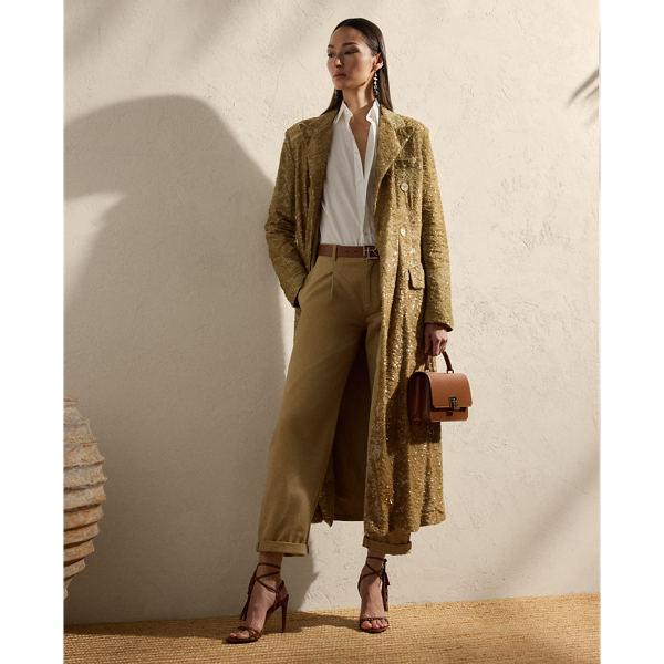 Cut for a relaxed fit and finished with traditional tailoring details, including peak lapels, waist darts and a vented back hem, the menswear-inspired Macy coat undergoes a unique artisanal process to achieve its stunning appearance. Using 100 percent cotton tulle as the base, this coat is meticulously embroidered by five highly trained technicians with 760,000 overlapping sequins. Once applied, a dip-dye technique is used to give the sequins various shades of colour, making each piece truly one of a kind.