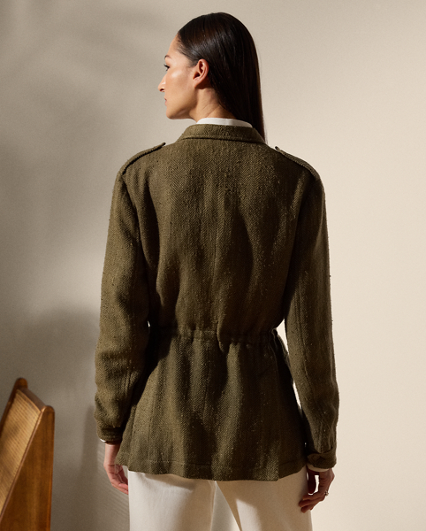 Celebrating the spirit of utility, the Schmitt jacket is designed with a bevy of considered details, including buttoned shoulder epaulets, patch pockets on the chest and waist and an interior drawcord. This Italian-made style is crafted in the season’s tonal herringbone tweed – a fabric made with a blend of mulberry silk, tussah silk and linen selected for its luxurious hand feel.