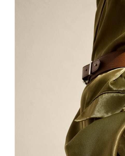 Melding the soft construction of a men's robe with the design elements of a structured blazer, the Quinton is  Ralph Lauren Lauren's modern rendition of a women's smoking jacket. Made in Italy with a luxurious satin fabrication that was specially developed with metallicised yarns woven on a fine silk-blend warp to achieve a fluid metal effect, this jacket is finished with a self-belt that's intended to be knotted at the waist.