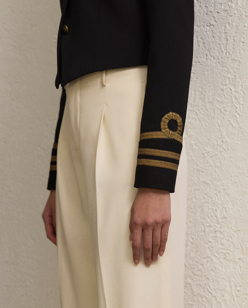 Cut for a slim, cropped fit, the Carraway jacket is crafted in Italy from double-faced wool crepe and features elevated design elements, including brass buttons embossed with Ralph Lauren Lauren's monogram and metallic soutache embroidery.