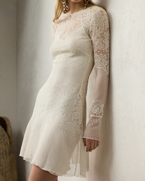 Featuring a romantic floral lace design, this long-sleeve day dress is crafted in Italy with fine-gauge silk yarn, which is specially treated to achieve an organza-like hand feel. Cut for a slim silhouette that hits at the thigh, this sheer style includes a detachable slip dress lining for opacity.