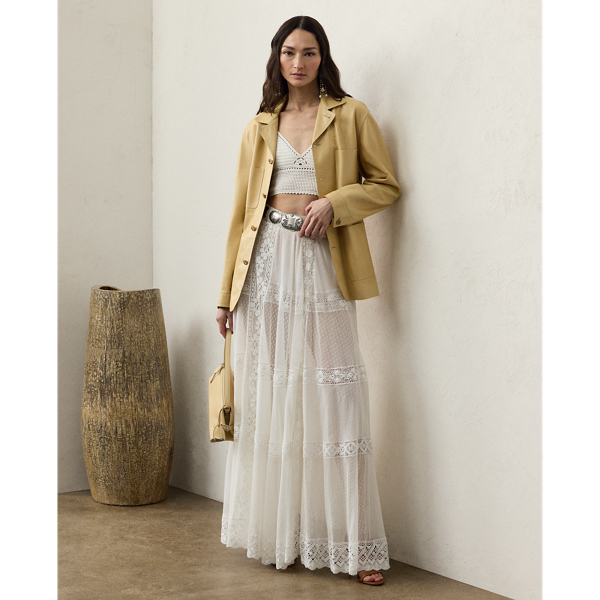 Striking a balance between elegance and rusticity, the Malti skirt's maxi-length silhouette is constructed with a series of panels and luxurious layers. A mesh lace fabric serves as the under layer, while alternating panels of sheer cotton-and-silk voile and tulle unite with hand-embroidered lace to create the exterior fabric. Crafted in Italy, this style is equipped with side on-seam pockets and a cotton lining for opacity.