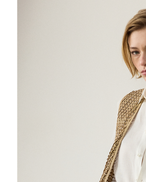 Utilising the dedicated crafting of eight highly skilled artisans, the Tabetha waistcoat undergoes a multi-step artisanal process to achieve its unique silhouette. To begin, the graphic designer and the pattern department collaborate to create the pattern paper used for this style. Experienced cutters select the highest quality skins for this piece, cutting the leather into 5 cm strips and weaving them together by hand to follow the pattern placement and form the panels that make up the waistcoat's timeless design. Finally, tonal lambskin piping is applied to frame the garment. Additional touches, including a lamb-suede drawcord with "RL"-engraved imitation horn cord ends and besom pockets, complete the look.