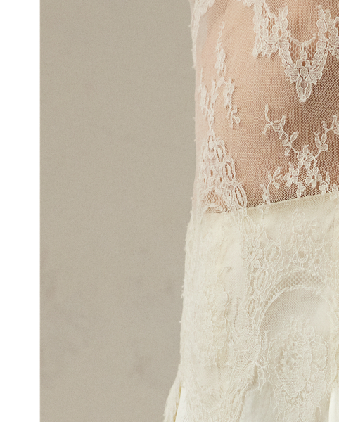 A study in fine Italian crafting, the Delilah's intricate design is formed with delicate French lace and hand-applied details, including floral embroidery and scalloping. Equipped with a camisole lining for opacity, this long-sleeve blouse features genuine mother-of-pearl buttons at the back and sleeve cuffs for ease of entry.