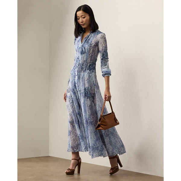 The Hannes day dress revamps  Ralph Lauren Lauren's signature shirtdress silhouette with an array of highly considered design elements, including a tie-neck accent, crisp pleating and side on-seam pockets. Italian-made, this sweeping A-line style is crafted with lightweight, textured linen-and-silk gauze printed with the season's stylised floral garden pattern, which is enhanced with macramé lace detailing throughout for an artisanal touch.