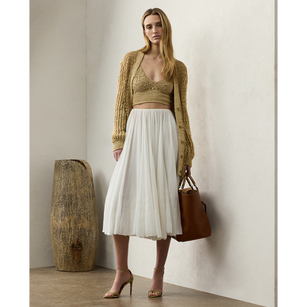 Crafted in Italy with breezy cotton voile, this version of the Trivelas skirt undergoes an intensive process to achieve its pleated, shimmering finish. Six specialised technicians first utilised an innovative fabric-manipulation technique, known as soleil, to meticulously fold the fabric to create its pleated effect. Next, a total of 280,000 shimmering sequins are applied in rows along the bottom of the skirt, creating a light catching finish that showcases Mr Lauren's commitment to quality crafting.