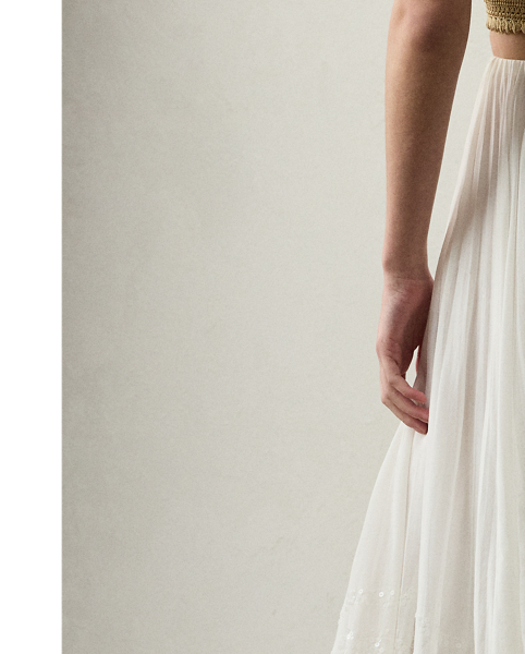 Crafted in Italy with breezy cotton voile, this version of the Trivelas skirt undergoes an intensive process to achieve its pleated, shimmering finish. Six specialised technicians first utilised an innovative fabric-manipulation technique, known as soleil, to meticulously fold the fabric to create its pleated effect. Next, a total of 280,000 shimmering sequins are applied in rows along the bottom of the skirt, creating a light catching finish that showcases Mr Lauren's commitment to quality crafting.