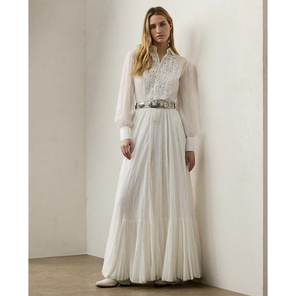 Capturing the relaxed sophistication that defines summer in the Hamptons, the Seymour day dress is crafted with lightweight, breathable cotton voile, which is finely woven to create micro-pleats for added volume and sweeping movement. With an array of romantic elements, including blouson sleeves, extended sleeve cuffs and a rounded collar, this dress spotlights an embroidered bib, which is formed using a special punch-needle technique that reproduces a macramé lace effect.