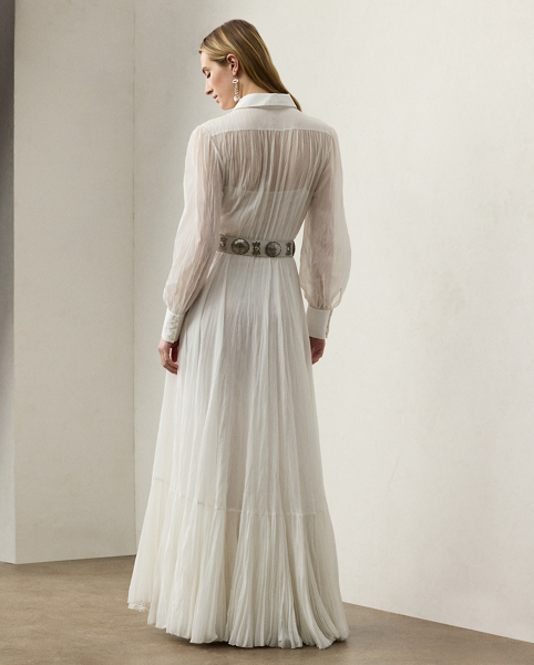 Capturing the relaxed sophistication that defines summer in the Hamptons, the Seymour day dress is crafted with lightweight, breathable cotton voile, which is finely woven to create micro-pleats for added volume and sweeping movement. With an array of romantic elements, including blouson sleeves, extended sleeve cuffs and a rounded collar, this dress spotlights an embroidered bib, which is formed using a special punch-needle technique that reproduces a macramé lace effect.