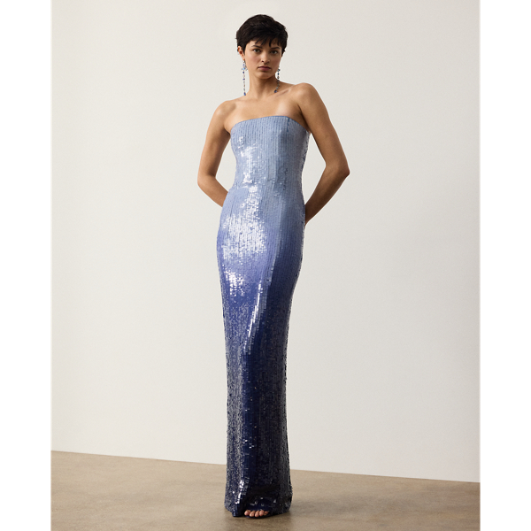 The Jennette dress reflects the serene beauty found in the interplay of sea and sky with its striking ombré colouring. To begin, a team of five specialised technicians applied 220,000 square-shaped sequins across a cornflower blue silk georgette base, resulting in an allover lacquered finish. Once applied, the sequins are specially dyed by hand to achieve a stunning dégradé effect. This dress is designed with a strapless column silhouette, creating an elegant style that transcends time.