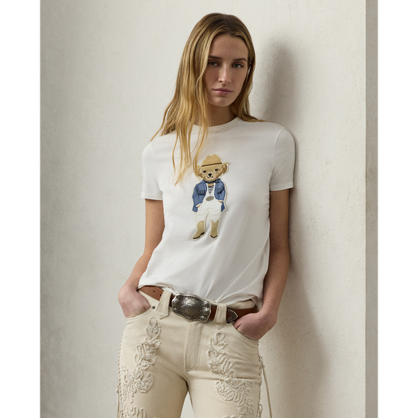 Capturing the relaxed sophistication that defines summer in the Hamptons, Spring 2025 Collection's blue-and-white colour palette nods to the interplay between sky and sea, which is brought to life here in the season's Polo Bear tee. Donning an outfit informed by Mr Lauren's penchant for Western style, a master embroiderer created the Hamptons Spring Polo Bear from highly considered materials, including rustic lamb suede for the season's Western-inspired Rennie jacket, silk jersey for the striped tee, cotton broadcloth for the shirt, washed linen-blend canvas for the trousers, double silk georgette for the bandanna, dry-cleanable lamb suede for the cowboy boots and cowboy hat, and metallic thread for  Ralph Lauren Lauren Collection's signature Rodeo-Buckle belt. This T-shirt is crafted with cotton jersey and finished with " Ralph Lauren Lauren" script embroidery.