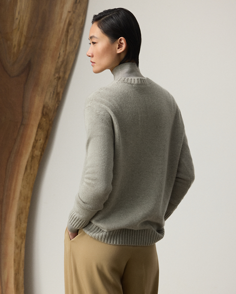 This lofty cashmere jumper depicts the Polo Bear in an outfit informed by the understated elegance that defines Pre-Autumn 2025 Collection. A team of six master embroiderers created the season's Racing Green Trench Polo Bear with highly considered materials, including synthetic leather for the bear's shoes, Ralph Lauren Tote and trench coat – whose colour is directly inspired by one of Mr Lauren's iconic vehicles – wool trench for the trousers, rib-knit silk-cotton for the roll neck and hot-fixed crystals for the diamond earrings.