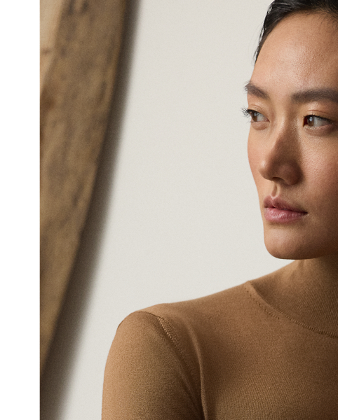 A timeless wardrobe staple,  Ralph Lauren Lauren Collection puts a luxurious spin on the mockneck jumper with a stretch-infused silk jersey fabrication and a slim fit.