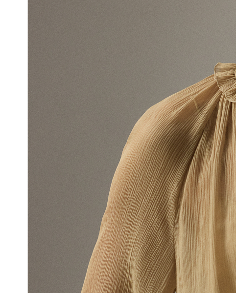 Epitomising the romantic allure that defines  Ralph Lauren Lauren Collection, this blouse is designed with an array of highly considered elements, including delicate shirring, billowing blouson sleeves and ruffle trim along the band collar. Effortlessly elegant, the Brooklyn is crafted in Italy from 100% silk chiffon woven with a crinkle texture, providing depth and dimension while remaining sheer and breezy.