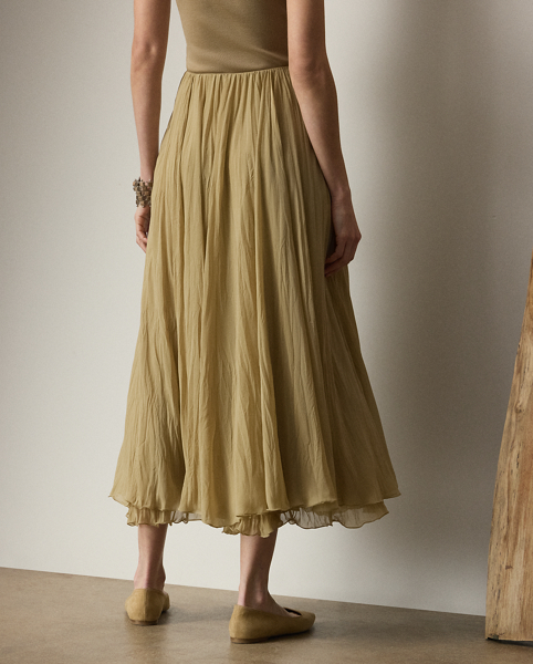 Crafted in Italy from elegant, lightweight chiffon, the season's Jordyn skirt undergoes a bark pleating process to achieve its stunning texture, lending dimension and movement to its breath-taking design.