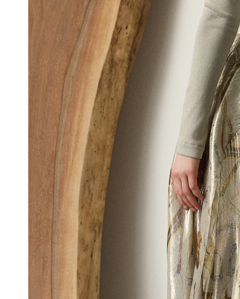 First introduced in  Ralph Lauren Lauren's 1985 Equestrian collection for women, Mr Lauren's fondness for traditional riding attire has since become a defining characteristic of the house, which is evident in the Pre-Autumn 2025 Patricia skirt. Crafted from shimmering, silver-tone lamé fabric, this evening style is printed in a renowned Como, Italy, mill with the season's allover equestrian-inspired motif. Engineered design details, including a skirt slit and fluid flounced panels placed along the bias, create beautiful movement with each and every step.